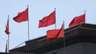 Flags fly atop the Great Hall of the People in Beijing, China, on Wednesday, March 6, 2019. Ongoing trade tensions with the U.S. and slowing growth have taken a toll on China’s economy. Those issues are dominating the National People’s Congress, an annual gathering of the country’s most powerful officials that continued Wednesday in Beijing. 