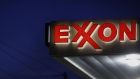 Exxon Mobil Corp. signage is displayed at a gas station in Richmond, Kentucky. 