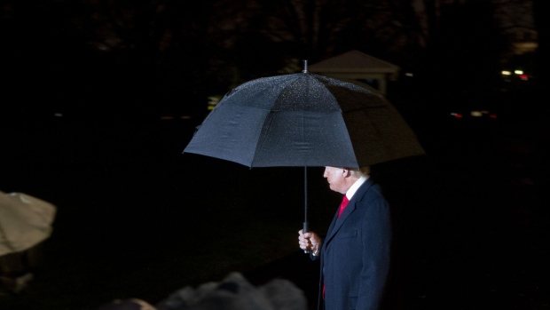 U.S. President Donald Trump steps away after speaking to members of the media before boarding Marine One on the South Lawn of the White House in Washington, D.C., U.S., on Tuesday, Dec. 10, 2019. House Democrats delivered two tightly crafted articles of impeachment against Trump today that urged his removal as president for abusing the power of his office and keeping Congress from exercising its duty as a check on the executive branch. 