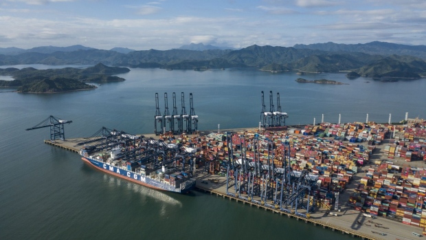 A CMA CGM container ship sits anchored at the Yantian International Container Terminals, operated by CK Hutchison Holdings Ltd.'s Hutchison Port Holdings Trust (HPH Trust), in this aerial photograph taken in Shenzhen, China, on Friday, Sept. 6, 2019. Shenzhen is young, hopeful and looks optimistically toward a future where it can help drive China’s push to dominate the next century through an innovative economy that sidesteps political freedoms. The city also has the centralized control, relentless efficiency and advanced manufacturing that lie at the root of President Xi Jinping’s concept of China’s future greatness. 