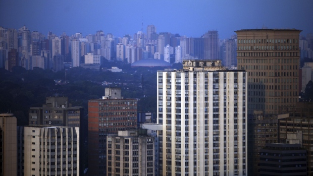 Buildings stand in the city skyline as seen from the Pinheiros neighborhood in Sao Paulo, Brazil, on Monday, Aug. 20, 2012. Analysts covering Brazil’s economy cut their 2012 growth forecast for the third straight week, even after recent signs that the economy may be picking up speed. 