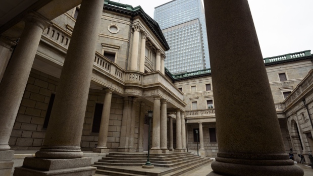 The Bank of Japan (BOJ) headquarters stand in Tokyo, Japan, on Tuesday, July 16, 2019. The BOJ would offer support for a government spending package likely to be unveiled in October when a national sales tax is increased, according to a former central bank official. 