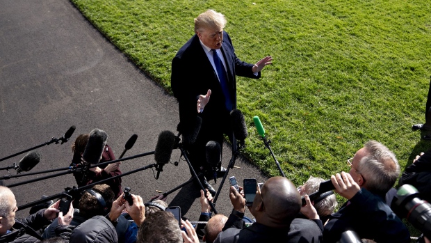 Donald Trump speaks to members of the media before boarding Marine One on the South Lawn of the White House in Washington, D.C. 