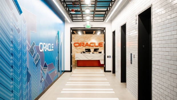 Signage is displayed at the cloud infrastructure department of an Oracle Corp. office in Seattle, Washington, U.S., on Thursday, July 19, 2018. Microsoft Corp. and Oracle Corp. announced a cloud interoperability partnership enabling customers to migrate and run mission-critical enterprise workloads across Microsoft Azure and Oracle Cloud. 