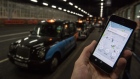 An Uber Technologies Inc. ride-hailing service smartphone app sits on a smartphone display in this arranged photograph at a taxi rank in London, U.K., on Friday, Dec. 22, 2017. Uber will be regulated in European Union countries as a transport company after the bloc's top court rejected its claim to be a digital service provider, a decision that could increase legal risks for other gig-economy companies including Airbnb. 