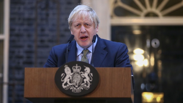 Boris Johnson, U.K. prime minister, delivers a speech outside number 10 Downing Street in London, U.K., on Friday, Dec. 13, 2019. Johnson won an emphatic election victory that redraws the political map of Britain and gives the prime minister the mandate he needs to pull the U.K. out of the European Union next month. 