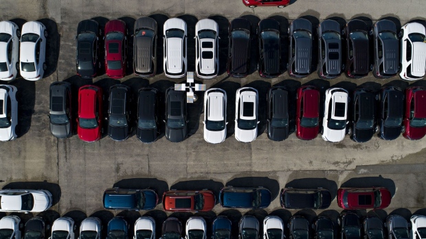 General Motors Co. vehicles are displayed at a car dealership in this aerial image over Tinley Park, Illinois, U.S., on Monday, Sept. 30, 2019. Auto sales in the U.S. probably took a big step back in September, setting the stage for hefty incentive spending by carmakers struggling to clear old models from dealers' inventory. 
