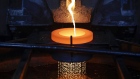 Molten gold flows into water to produce the gold casting grain at the Valcambi SA precious metal refinery in Balerna, Switzerland, on Tuesday, April 24, 2018. Gold's haven qualities have come back in focus this year as President Donald Trump’s administration picks a series of trade fights with friends and foes, and investors fret about equity market wobbles that started on Wall Street and echoed around the world. 