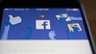 The Facebook Inc. application is displayed for a photograph on an Apple Inc. iPhone in Washington, D.C., U.S., on Wednesday, March 21, 2018. Facebook is struggling to respond to growing demands from Washington to explain how the personal data of millions of its users could be exploited by a consulting firm that helped Donald Trump win the presidency. 