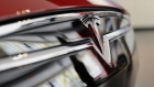 The Tesla Motors Inc. logo is seen on the grill of a Model S P85D electric vehicle (EV) at the company's retail store in San Jose, California, U.S., on Thursday, Aug. 20, 2015. 