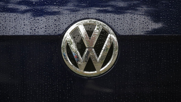 Raindrops rest on the badge of a used Volkswagen Golf automobile outside a Volkswagen AG (VW) showroom in Berlin, Germany, on Wednesday, July 26, 2017. Carmakers' shares have dropped since Spiegel magazine reported Friday that Daimler and Volkswagen informed authorities last year of discussions they'd had since the 1990s that also included BMW AG. 
