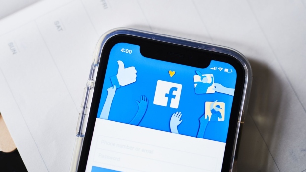 The Facebook Inc. logo is displayed on an Apple Inc. iPhone in this arranged photograph taken in Greenwich, Connecticut, U.S., on Monday, April 23, 2019. 
