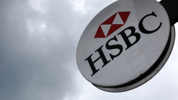 A logo sits outside a HSBC Holdings Plc bank branch in London, U.K., on Tuesday, May 2, 2017. HSBC has appeased investors with $3.5 billion of share buybacks, but after five years of declining revenue analysts are looking for evidence the bank is stabilizing its top line when it reports earnings Thursday. 