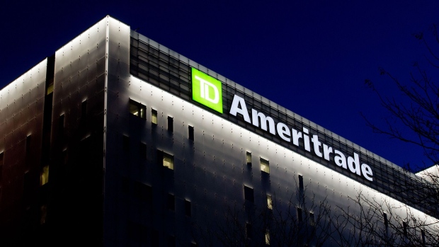 TD Ameritrade Holding Corp. signage is illuminated atop the company's headquarters at night in Omaha, Nebraska. 