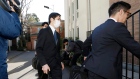 Prosecutors arrives at former Nissan Chairman Carlos Ghosn's residence for a raid in Tokyo