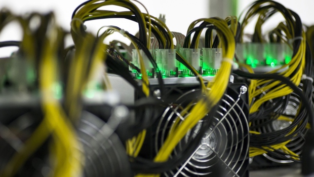 Bitmain Technologies Inc. application specific integrated circuit (ASIC) units sit on a shelf inside the DMM Mining Farm, operated by DMM.com Co., in Kanazawa, Japan, on Tuesday, March 20, 2018.