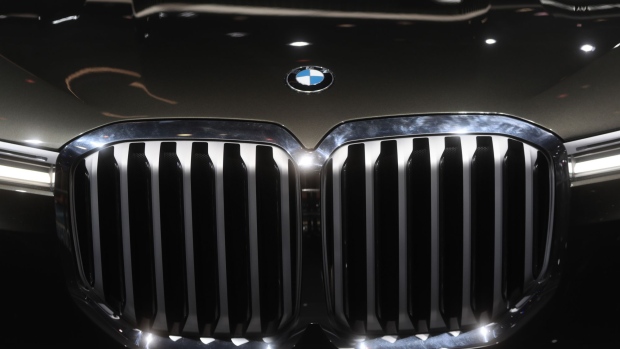 A badge sits above the grille of a BMW X7 sports utility vehicle, manufactured by Bayerische Motoren Werke AG (BMW), during the second media preview day of the IAA Frankfurt Motor Show in Frankfurt, Germany, on Wednesday, Sept. 13, 2017. The 67th IAA opens to the public on Sept. 14 and features must-have vehicles and motoring technology from over 1,000 exhibitors in a space equivalent to 33 soccer fields. Photographer: Simon Dawson/Bloomberg