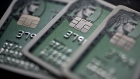 American Express Co. chip credit cards are arranged for a photograph in Washington, D.C., U.S., on Monday, Oct. 24, 2016. American Express surged the most in more than seven years after posting third-quarter profit that beat analysts' estimates and raising its full-year profit forecast. 