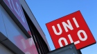 The Uniqlo logo is displayed atop a Uniqlo store, operated by Fast Retailing Co., in Totsuka Ward of Yokohama Yokohama, Japan, on Sunday, Feb. 4, 2018. Japan’s economy expanded for an eighth quarter, with its gross domestic product (GDP) grew at an annualized rate of 0.5 percent in the three months ended Dec. 31, but the pace of growth fell sharply and missed expectations. Photographer: Takaaki Iwabu/Bloomberg