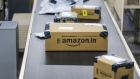 Packages move along a conveyor belt at the Amazon.com Inc. fulfillment center in Hyderabad, India. Photographer: Dhiraj Singh/Bloomberg