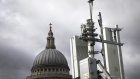 An array of 5G masts installed on a rooftop overlooking St. Paul's Cathedral