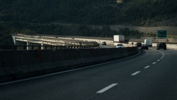 Traffic moves along a highway near Genoa, Italy. Photographer: Federico Bernini/Bloomberg