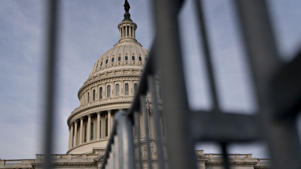 The U.S. Capitol stands past metal fencing in Washington, D.C., U.S., on Thursday, Jan. 2, 2020. House Speaker Nancy Pelosi and Senate Majority Leader Mitch McConnell are locked in a stare-down over the terms of President Donald Trump's impeachment trial, which carries political risks for both sides if it continues deeper into January. Photographer: Andrew Harrer/Bloomberg
