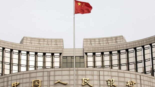 A Chinese flag flies in front of the People's Bank of China headquarters in Beijing, China, on Monday, Jan. 7, 2019.  Photographer: Giulia Marchi/Bloomberg