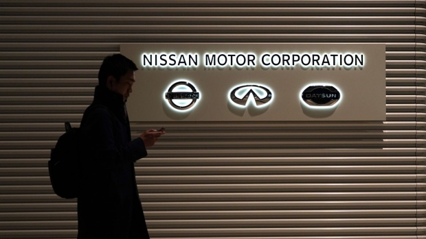 Logos for Nissan Motor Co., left, Infiniti, center, and Datsun are displayed on an illuminated sign outside the Nissan Motor Co. headquarters in Yokohama, Japan, on Thursday, Jan. 9, 2020. Nissan’s executives mostly derided attacks by Carlos Ghosn, who lashed out at the automaker he used to lead in a closely watched news conference in Lebanon following his stunning escape from trial in Japan. Photographer: Toru Hanai/Bloomberg