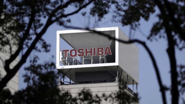 Signage for Toshiba Corp. is displayed atop the company's headquarters in Tokyo, Japan, on Tuesday, March 28, 2017. Toshiba Corp. projected its annual loss could more than double to a record 1.01 trillion yen ($9.1 billion) as its U.S. nuclear unitWestinghouse Electric filed for Chapter 11 bankruptcy in New York court. Photographer: Kiyoshi Ota/Bloomberg