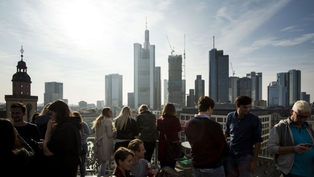 FRANKFURT AM MAIN, GERMANY - OCTOBER 20: Guests stand at the rooftop of a shopping mall and look at the skyline and the finance district on October 20, 2018 in Frankfurt, Germany. Skyrocketing costs for housing have become a major issue in cities across Germany, with local government scrambling to find policy solutions. Frankfurt in particular is already attracting wealthy newcomers as the city becomes an alternative for companies in the financial sphere relocating from Brexit-afflicted London. In other cities, especially Berlin, foreign investors, including from China, are parking their money in luxury apartment purchases. (Photo by Thomas Lohnes/Getty Images) Photographer: Thomas Lohnes/Getty Images Europe
