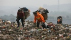 GETTY IMAGES - Scavengers pick up plastic bags at an open dump on April 2, 2008 in Chongqing Municip