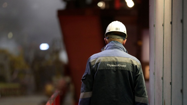 An employee walks along the steel rolling production line at the Thyssenkrupp AG metals plant in Duisburg, Germany, on Thursday, March 7, 2019. Tata Steel Ltd. is likely to offer parts of its European packaging activities to receive regulatory approval for a planned joint venture with Thyssenkrupp, Reuters reports, citing three unidentified people familiar with the matter. Photographer: Krisztian Bocsi/Bloomberg