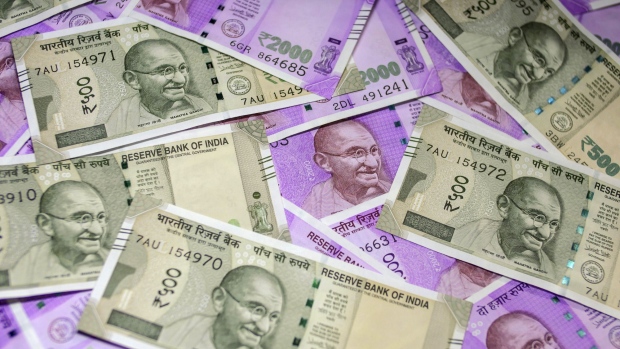 Indian two thousand and five hundred rupee banknotes are arranged for a photograph in Mumbai, India, on Sunday, Jan. 29, 2017. Reviving India's growth and boosting demand are essential as gross domestic product is likely to grow 7.1 percent in the year through March, the slowest pace in three years -- and this is before considering the impact of currency shortages in an economy where 98 percent of consumer payments are made in cash. Photographer: Dhiraj Singh/Bloomberg