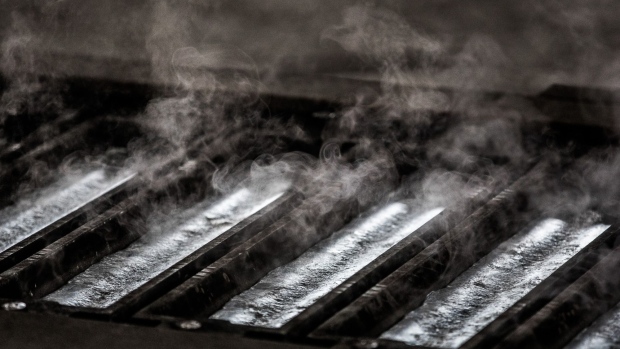 Steam rises from olten aluminum as it cools inside ingot molds at the Alumetal Group Hungary Kft. aluminium processing plant in Komarom, Hungary on Monday, March 19, 2018. The European Union believes it's on track to be exempted from imminent U.S. tariffs on foreign steel and aluminium, dialling down the risk of a trans-Atlantic trade war. Photographer: Akos Stiller/Bloomberg