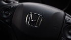 The Honda Motor Co. badge is displayed on the steering wheel of a vehicle at the company's showroom in Tokyo, Japan, on Tuesday, Aug. 1, 2017. Honda is scheduled to report first-quarter earnings figures today. Photographer: Kiyoshi Ota/Bloomberg