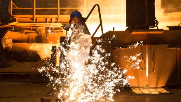 Sparks fly as a worker pours molten cast iron he has collected from a blast furnace at the Novolipetsk Steel PJSC plant, operated by NLMK Group, in Lipetsk, Russia, on Monday, June 18, 2018. Metals magnate Vladimir Lisin slipped past rival Alexey Mordashov as shares of Lisin’s Novolipetsk Steel PJSC climbed 3.5 percent, pushing his fortune to $20.19 billion, according to the Bloomberg Billionaires Index, a ranking of the world’s 500 richest people. Photographer: Andrey Rudakov/Bloomberg
