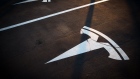 A Tesla Inc. logo marks an empty parking bay at a Supercharger station in Sant Cugat, Spain, on Wednesday, July 10, 2019. 
