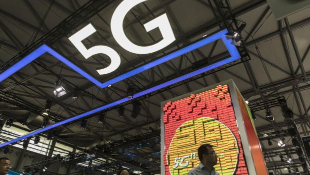 Signage for 5G is displayed at the China Unicom Hong Kong Ltd. booth at the MWC Shanghai exhibition in Shanghai, China, on Thursday, June 27, 2019. The Shanghai event is modeled after a bigger annual industry show in Barcelona. Photographer: Qilai Shen/Bloomberg