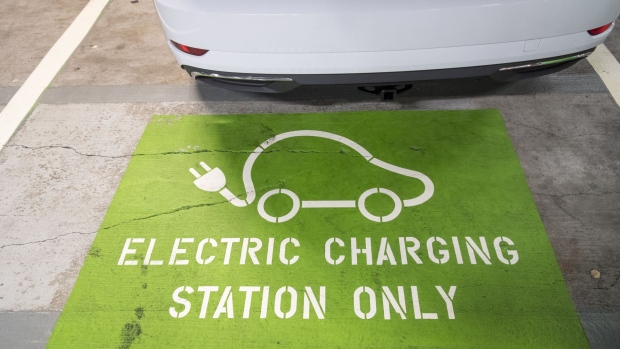 An "Electric Charging Station Only" sign is seen at a parking space in San Francisco, California, U.S., on Monday, July 2, 2018. General Motors Co. has installed 18 fast chargers for its Cruise self-driving car unit in a parking facility on San Francisco's Embarcadero, a busy boulevard along the city's eastern shoreline where Uber Technologies Inc and Lyft Inc. have busy drivers. Photographer: David Paul Morris/Bloomberg