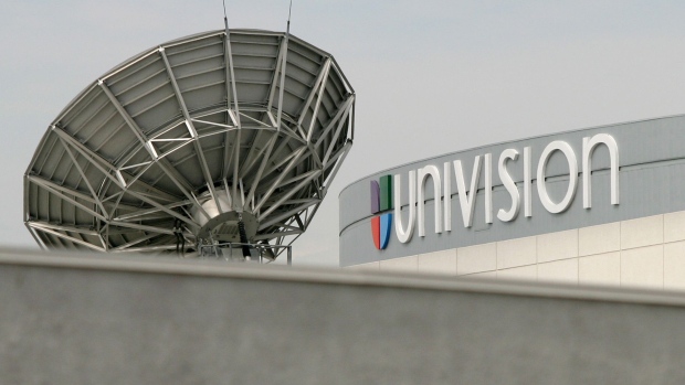 A satellite dish is positioned on the roof of Univision Communications Inc. in Los Angeles. Photographer: Tim Rue/Bloomberg