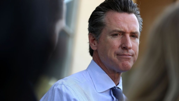 LARKSPUR, CA - JUNE 05: Democratic California gubernatorial candidate Lt. Gov. Gavin Newsom (R) talks with reporters after voting at the Masonic Temple Fairfax on June 5, 2018 in Larkspur, California. California Lt. Gov. Gavin Newson cast his ballot as California voters are heading to the polls to vote in the primary election. Newsom is expected to claim the top spot in the California gubernatorial primary election ahead of republican candidate John Cox and former Los Angeles mayor Antonio Villaraigosa, a democrat. (Photo by Justin Sullivan/Getty Images)