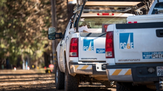 Pacific Gas & Electric Co. (PG&E) trucks sit on a roadside in Paradise, California, U.S., on Tuesday, Jan. 22, 2019. PG&E Co., California's biggest utility owner, faces $30 billion in potential wildfire liabilities, and its bankruptcy plan has reverberated across the power industry. The states big utilities have seen their shares plunge since November's deadly Camp Fire, and PG&E's debt rating has been cut to junk status. Photographer: David Paul Morris/Bloomberg