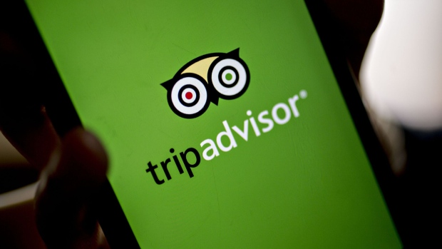 The TripAdvisor Inc. application is displyed on an Apple Inc. iPhone for a photograph in Washington, D.C., U.S., on Friday, May 5, 2017. TripAdvisor is scheduled to released earnings figures on May 9. Photographer: Andrew Harrer/Bloomberg