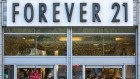 Pedestrians pass in front of a Forever 21 Inc. store in the Union Square neighborhood of New York, U.S., on Thursday, Aug. 29, 2019. Forever 21 Inc. is preparing for a potential bankruptcy filing as the fashion retailers cash dwindles and turnaround options fade, according to people with knowledge of the plans. Photographer: Jeenah Moon/Bloomberg