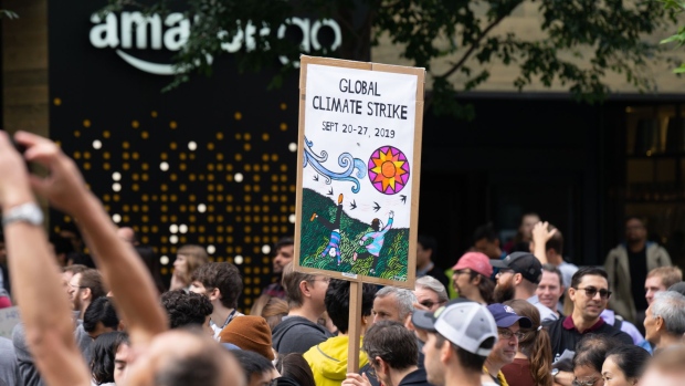 An Amazon.com Inc. employee carries a sign during the Global Climate Strike in Seattle on Sept. 20. Photographer: Chloe Collyer/Bloomberg
