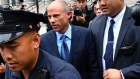 Michael Avenatti, center, exits from federal court in New York on May 28, 2019.
