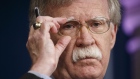 John Bolton, national security advisor, adjusts his glasses while speaking during a White House briefing in Washington, D.C., U.S., on Wednesday, Oct. 3, 2018. 