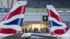 Tailfins of passenger jets operated by British Airways, a unit of International Consolidated Airlines Group SA (IAG), stand outside the terminal building at London City Airport in London, U.K.