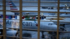 American Airlines Group Inc. planes sit at gates at Ronald Reagan National Airport (DCA) in Arlington, Virginia, U.S., on Wednesday, Nov. 27, 2019. The trade association Airlines for America has projected number of travelers will climb 3.7 percent from last year during the 12-day Thanksgiving travel period from Nov. 22 to Dec. 3. Photographer: Andrew Harrer/Bloomberg